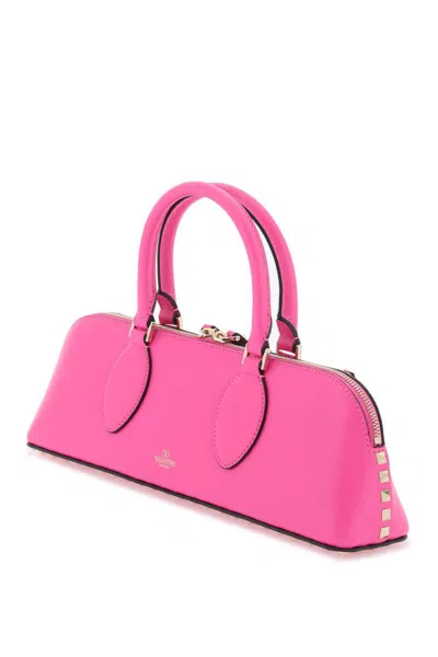 Shop Valentino Rockstud E/w Leather Handbag In Fuxia