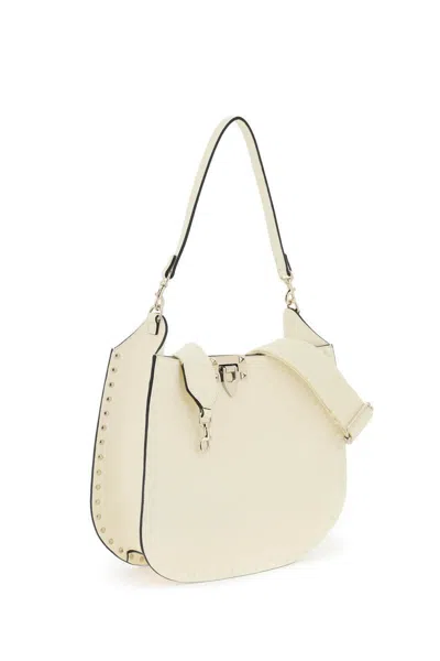 Shop Valentino Rockstud Hobo Bag In Bianco