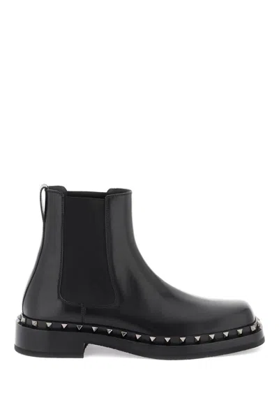 Shop Valentino Rockstud M-way Ankle Boots In Nero