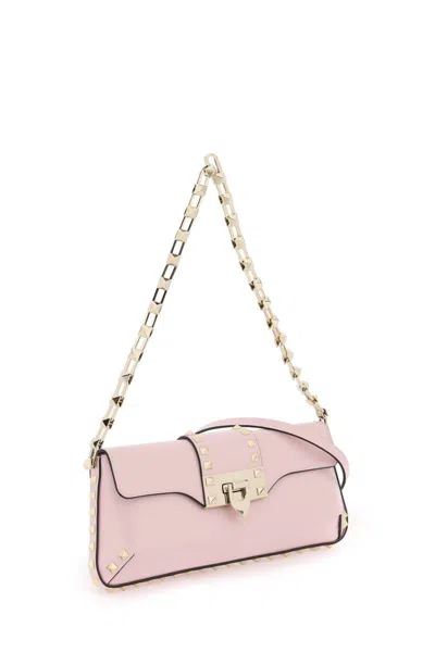 Shop Valentino Rockstud Shoulder Bag In Rosa