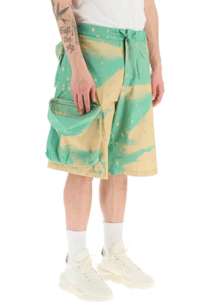 Shop Oamc Smudge Oversized Shorts With Maxi Pockets In Verde