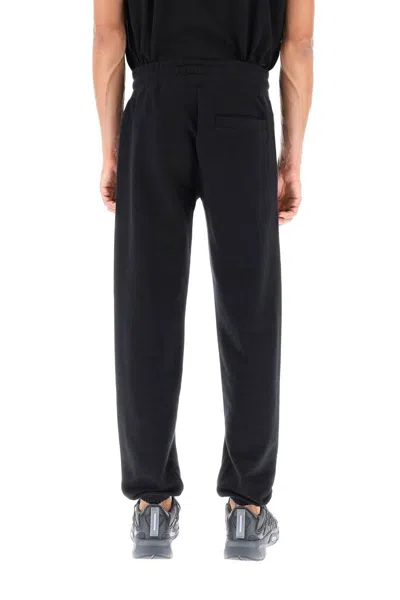 Shop Gcds Sweatpants With Logo Detail In Nero