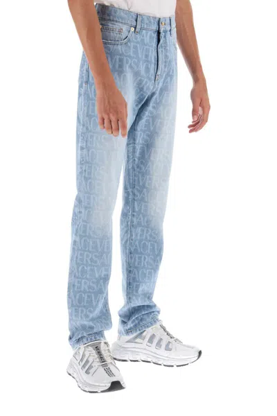 Shop Versace Allover Jeans In Blu