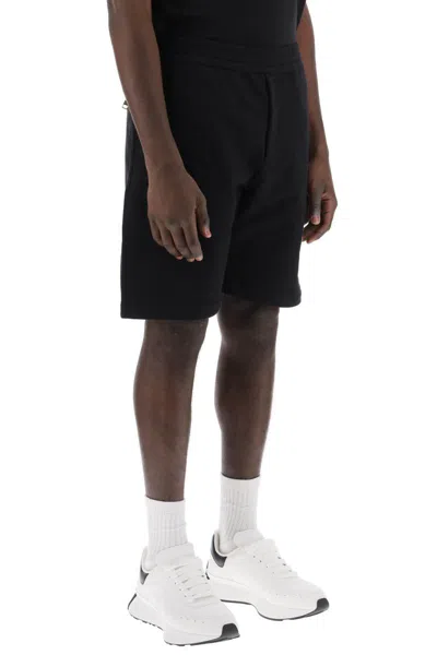 Shop Alexander Mcqueen Warped Logo Sweat Shorts In Nero
