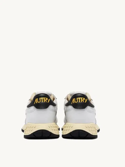 Shop Autry International Srl Reelwind Low Sneakers In Nylon And Black And White Leather