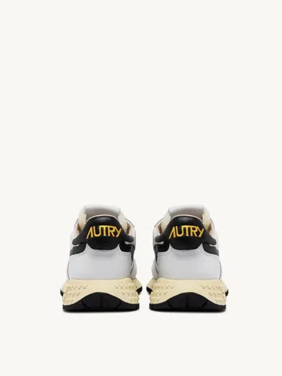 Shop Autry International Srl Reelwind Low Sneakers In Nylon And White Black Leather