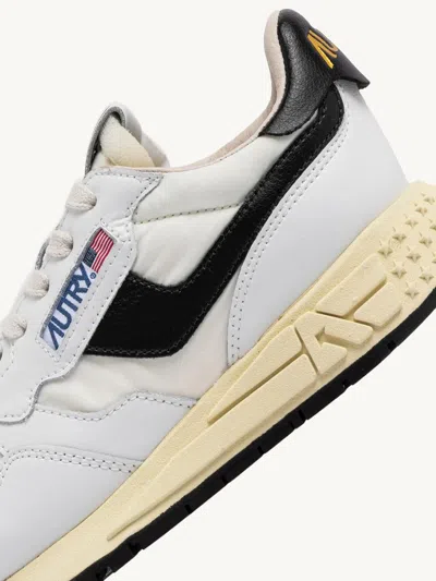 Shop Autry International Srl Reelwind Low Sneakers In Nylon And White Black Leather