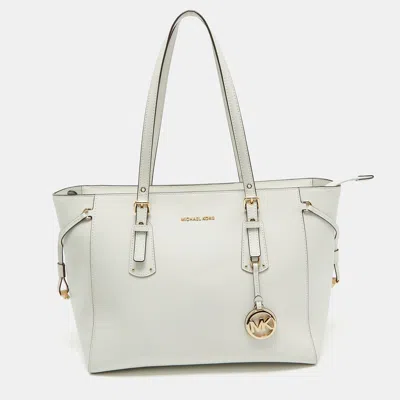 Shop Michael Kors Leather Voyager Tote In White
