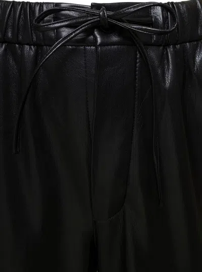 Shop Nanushka 'jain' Black Pants With Drawstring In Faux Leather Man