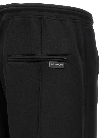 Shop Courrèges 'tracksuit Interlock' Pants In Black