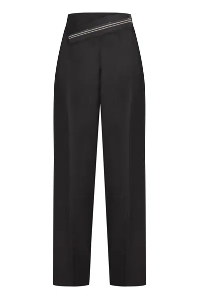 Shop Fendi Wool Carrot-fit Trousers In Black