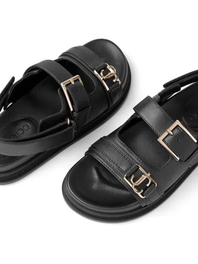 Shop Jimmy Choo Elyn Flat Leather Sandals In Black