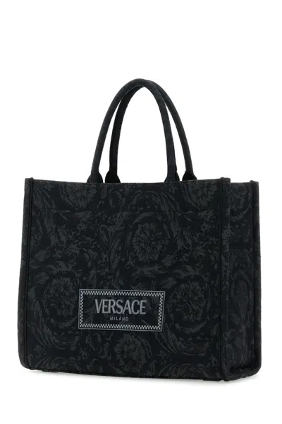 Shop Versace Handbags. In Blackblack