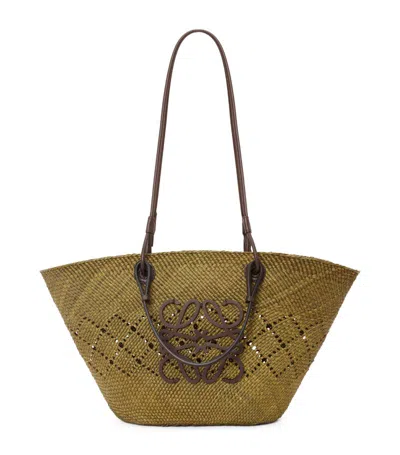 Shop Loewe X Paula's Ibiza Medium Woven Anagram Basket Bag In Green