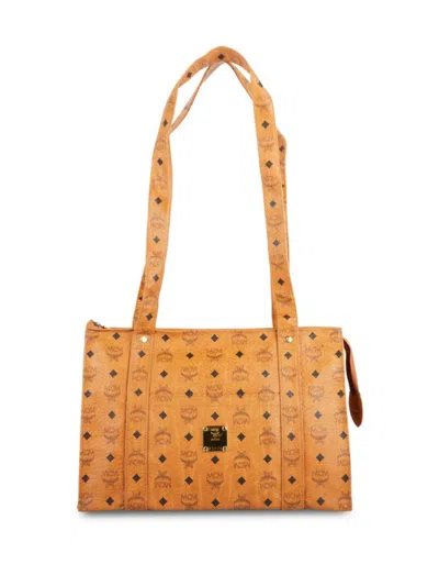 Shop Mcm Women's Monogram Leather Top Handle Bag In Cognac
