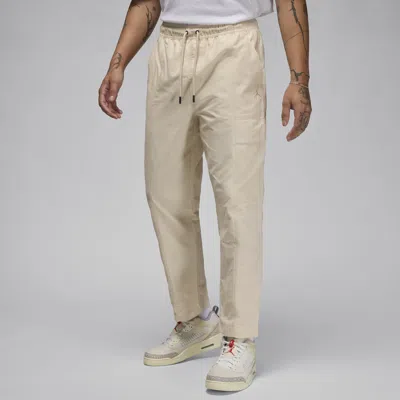 Shop Jordan Men's  Essentials Woven Pants In Brown