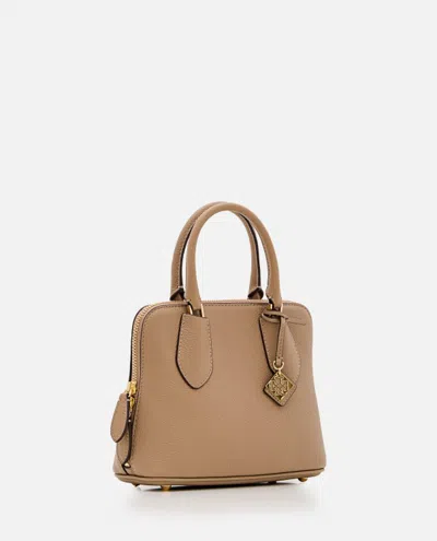 Shop Tory Burch Mini Pebbled Swing Leather Bag In Brown