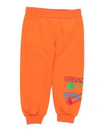 Shop Versace Young Toddler Pants Orange Size 3 Cotton, Elastane