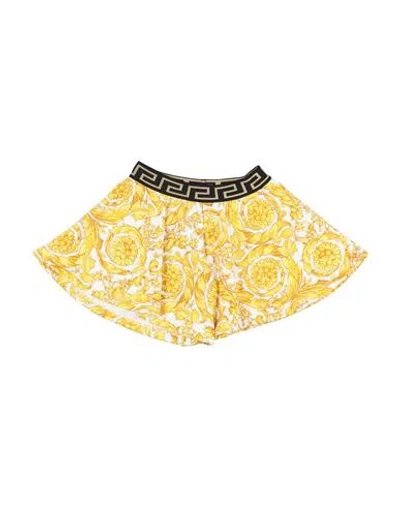 Shop Versace Young Toddler Girl Shorts & Bermuda Shorts Yellow Size 3 Cotton, Polyester, Elastane, Polyam