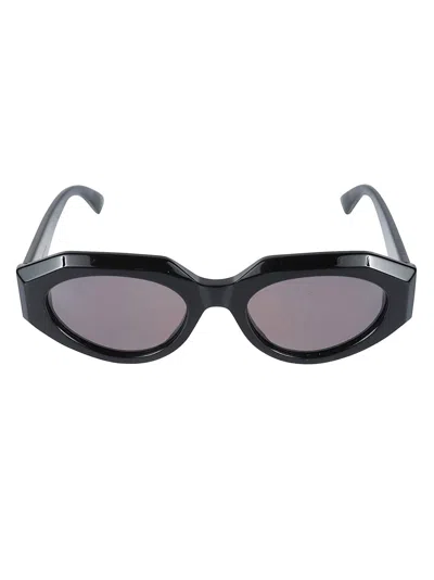 Shop Bottega Veneta Oval Frame Sunglasses In Black/grey