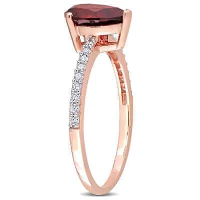 Pre-owned Amour 1 1/3 Ct Tgw Pear Shape Garnet And 1/7 Ct Tdw Diamond Ring In 14k Rose In Pink