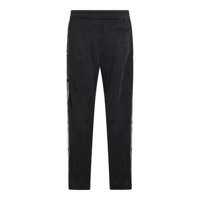 Shop Versace Trousers Black