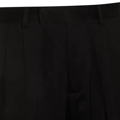 Shop Amiri Trousers Black