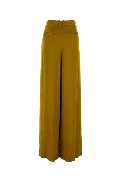 Shop Saint Laurent Pants In Yellow