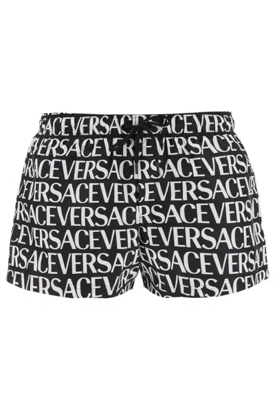Shop Versace Allover Swim Trunks In Bianco