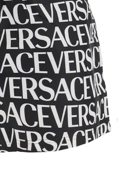 Shop Versace Allover Swim Trunks In Bianco