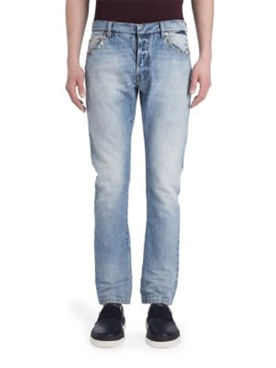 Shop Valentino Light Washed Rockstuded Denim Jeans In Light Blue