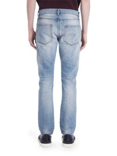 Shop Valentino Light Washed Rockstuded Denim Jeans In Light Blue