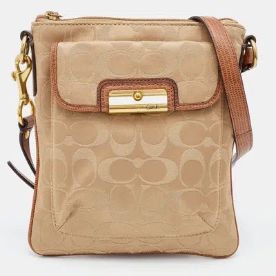 Shop Coach /brown Signature Canvas And Leather Courie Crossbody Bag