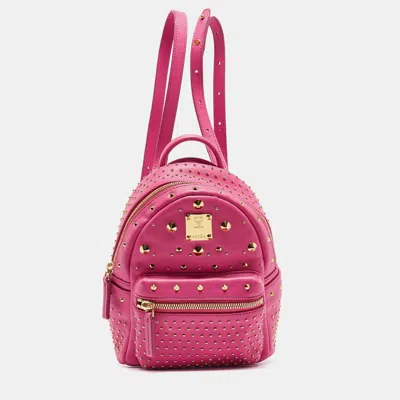 Shop Mcm Dark Leather Mini Studded Stark Backpack In Pink