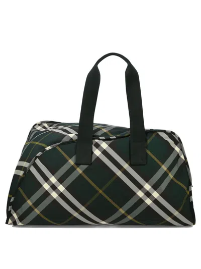 Shop Burberry Large "shield" Check-pattern Duffle Bag In Green