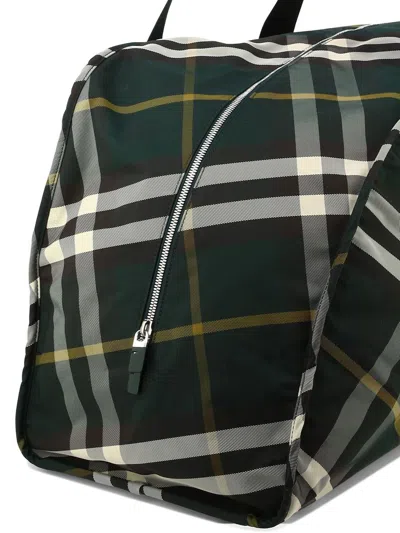 Shop Burberry Large "shield" Check-pattern Duffle Bag In Green