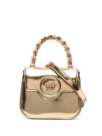 Shop Versace Mini La Medusa Patent Leather Bag In Golden