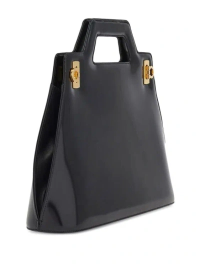 Shop Ferragamo Handbag In Black