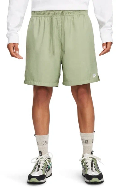 Shop Nike Club Woven Flow Shorts In Oil Green/ White