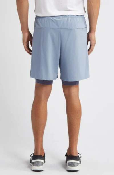 Shop Nike Dri-fit Unlimited 2-in-1 Versatile Shorts In Ashen Slate/ Light Carbon