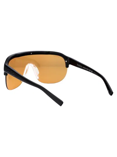 Shop Gucci Sunglasses In 005 Black Black Orange