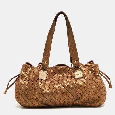 Shop Michael Kors Gold Woven Leather Drawstring Tote In Beige