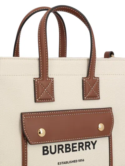 Shop Burberry Handbags In Natural/tan