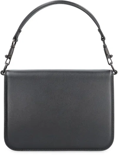 Shop Valentino Garavani - Locò Shoulder Bag In Black