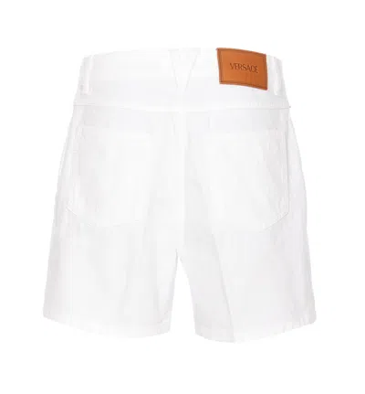 Shop Versace Shorts In White