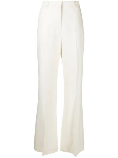 Shop Totême Toteme Flared Evening Trousers In Ivory