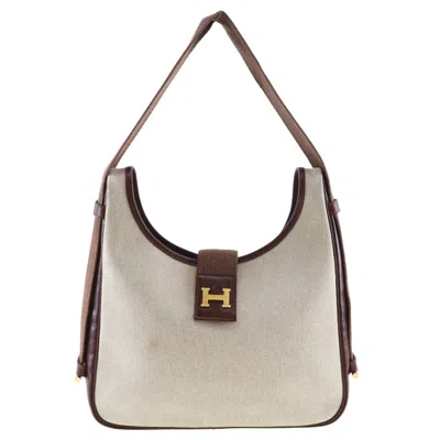 Shop Hermes Tsako Canvas Shoulder Bag () In Beige