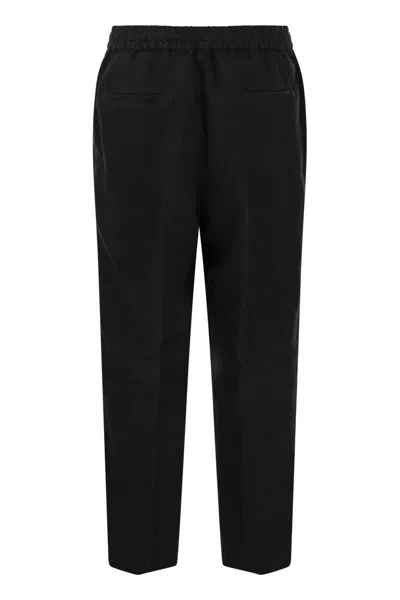 Shop Brunello Cucinelli Leisure Fit Trousers In Garment-dyed Linen Gabardine With Drawstring And Double D In Black