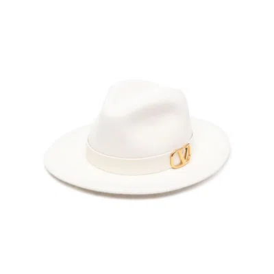 Shop Valentino Garavani Caps In White