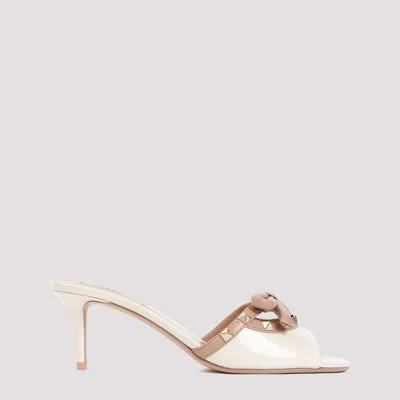 Shop Valentino Light Ivory Rose Cannelle Rockstud Patent Calf Leather Slides In Nude & Neutrals